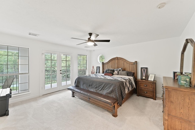 bedroom featuring light carpet, access to exterior, ceiling fan, and french doors