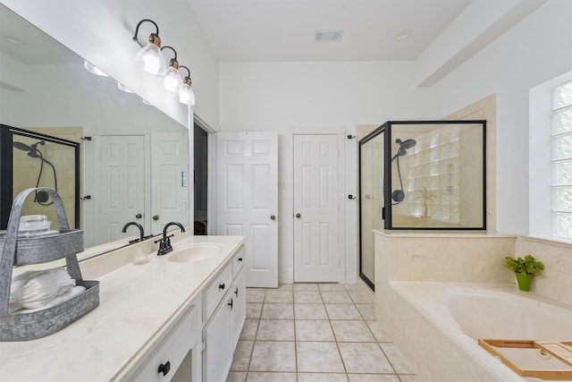 bathroom with vanity, independent shower and bath, and tile patterned flooring