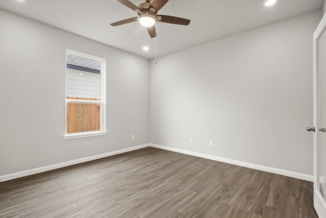 spare room featuring ceiling fan and wood-type flooring