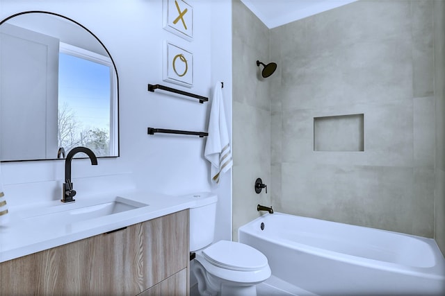 full bathroom with tiled shower / bath combo, vanity, and toilet