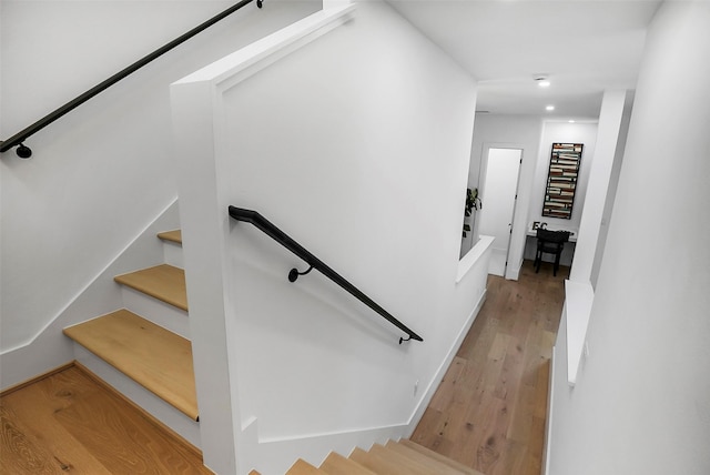 staircase featuring hardwood / wood-style flooring