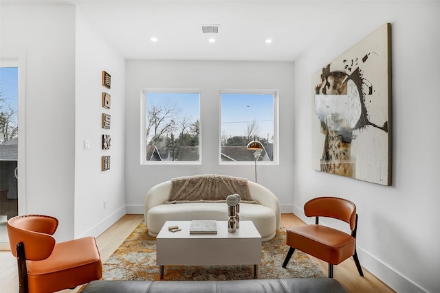 sitting room with light hardwood / wood-style flooring