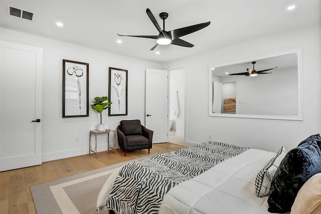 bedroom with wood-type flooring and ceiling fan