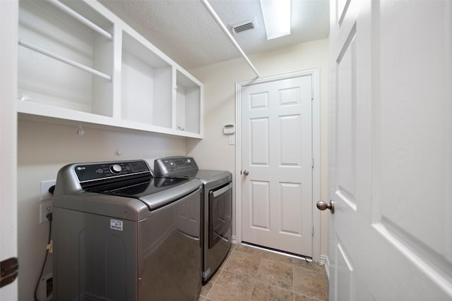 laundry room with washer and dryer