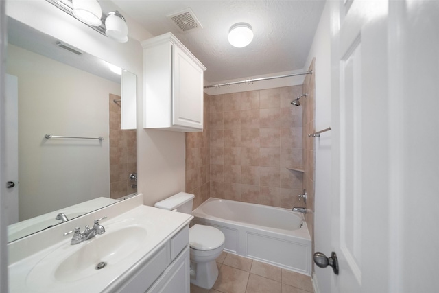 full bathroom with toilet, a textured ceiling, tiled shower / bath combo, tile patterned flooring, and vanity