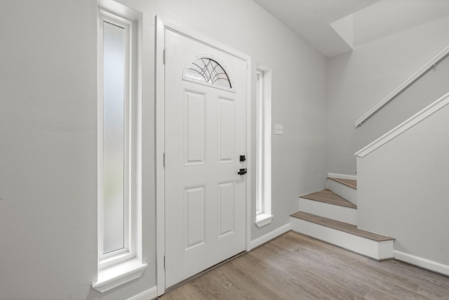 entryway with light hardwood / wood-style floors