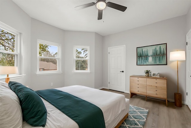 bedroom featuring ceiling fan and light hardwood / wood-style flooring