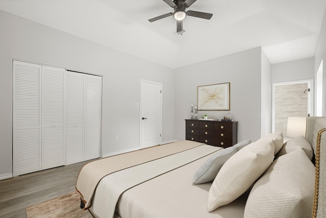 bedroom with light wood-type flooring, a closet, and ceiling fan