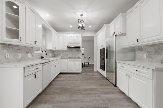 kitchen featuring white cabinetry and dishwasher