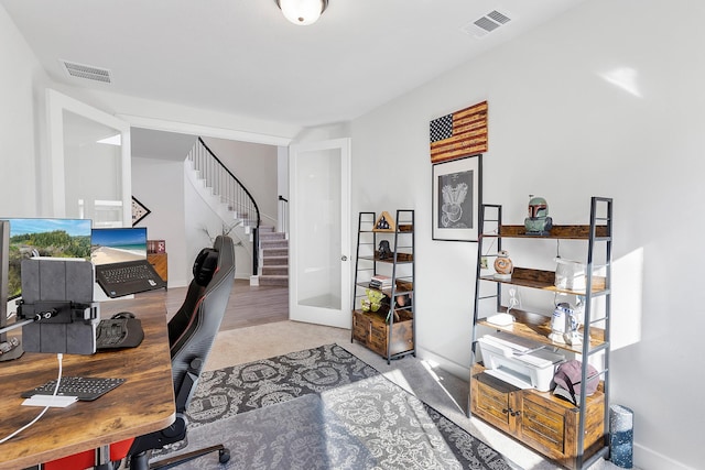 carpeted office featuring french doors