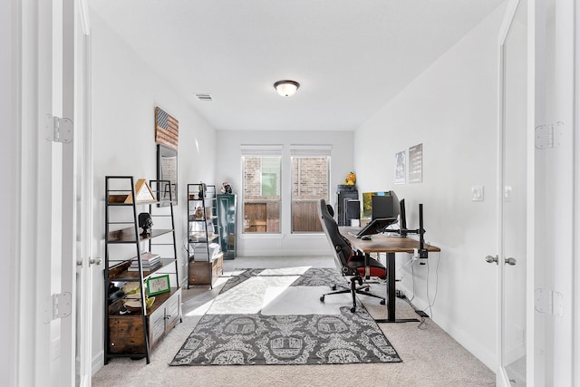 office area with light colored carpet