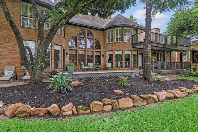 rear view of property with a deck