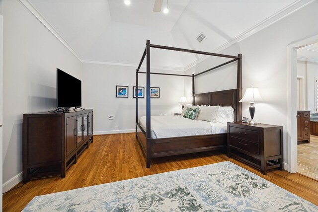 bedroom featuring ceiling fan, hardwood / wood-style floors, and crown molding