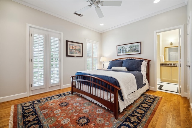 bedroom featuring light hardwood / wood-style floors, ensuite bath, ceiling fan, and ornamental molding