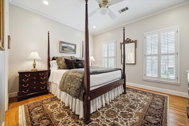 bedroom featuring light wood-type flooring, ceiling fan, and ornamental molding