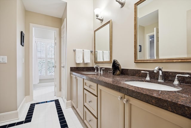 bathroom with vanity and tile patterned flooring