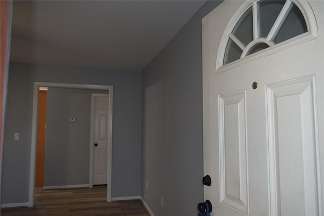 corridor featuring dark hardwood / wood-style floors