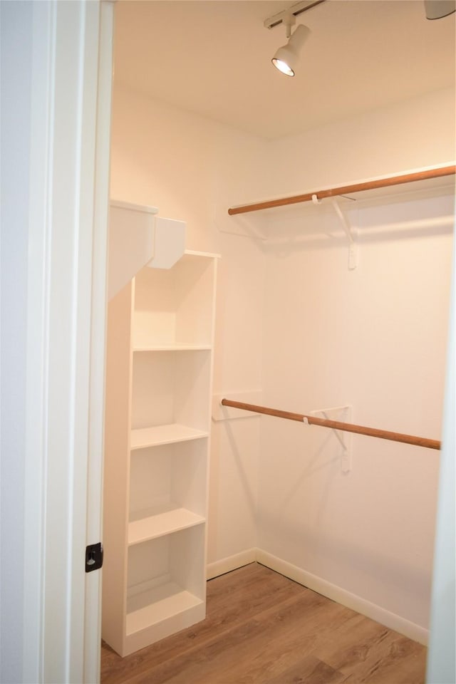 walk in closet featuring wood-type flooring