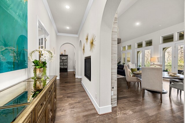 corridor with crown molding and dark hardwood / wood-style floors