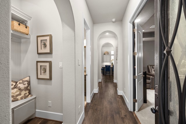 corridor featuring dark hardwood / wood-style flooring