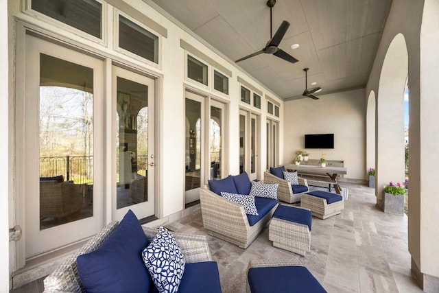 view of patio / terrace featuring ceiling fan and an outdoor living space