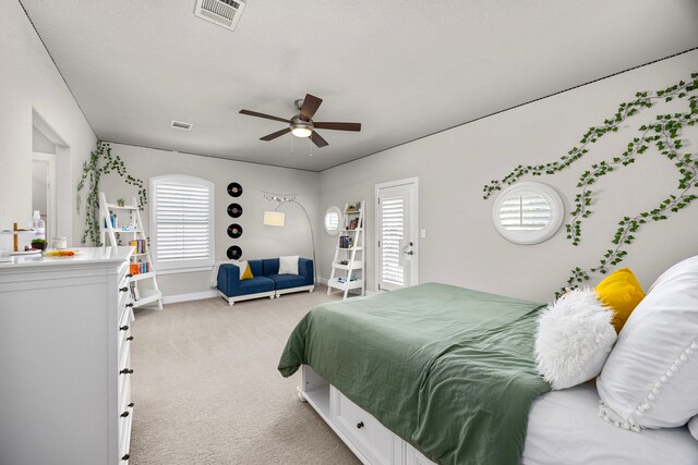 carpeted bedroom featuring ceiling fan