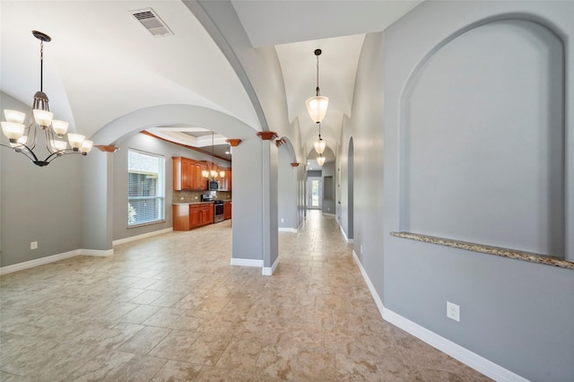 interior space featuring a chandelier and a tray ceiling