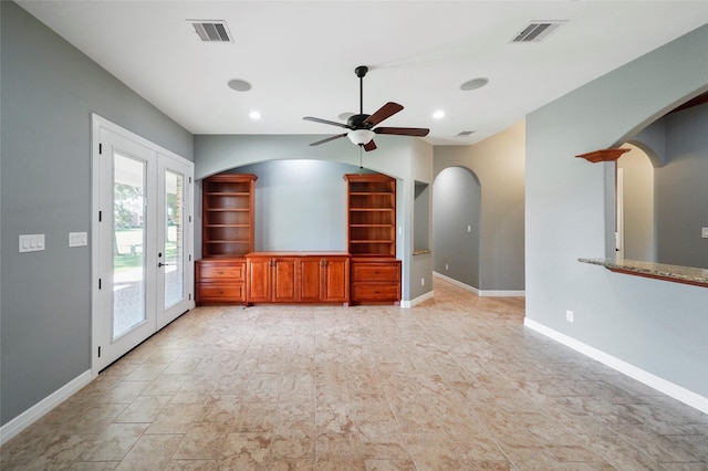 unfurnished living room with ceiling fan