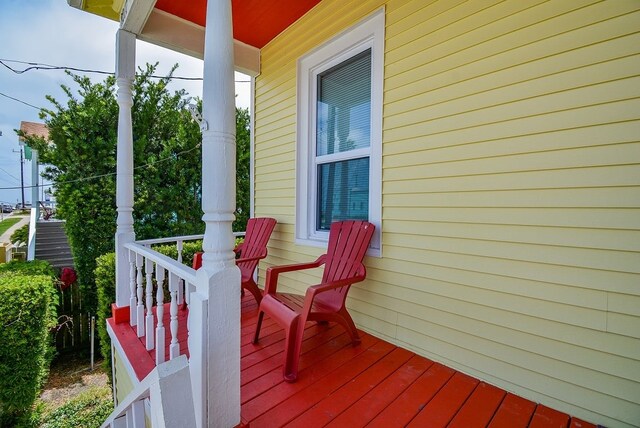 wooden terrace with a porch