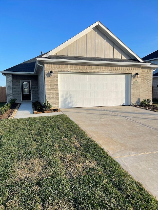 view of front of house with a garage and a front yard