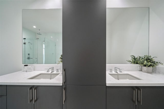 bathroom featuring walk in shower and vanity