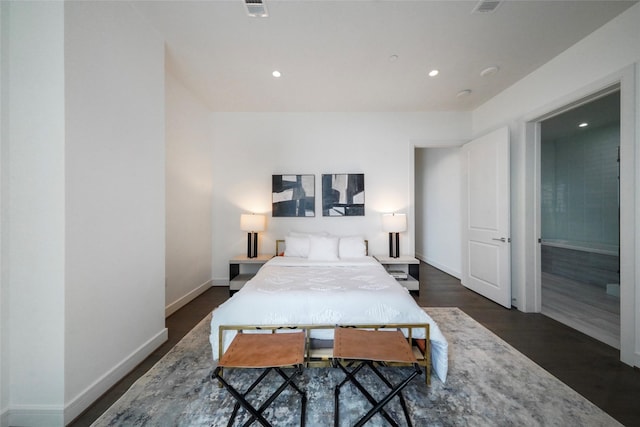 bedroom with dark hardwood / wood-style flooring