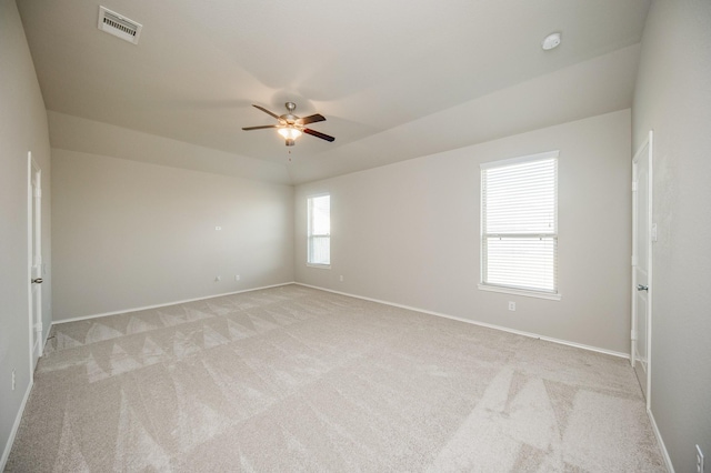 carpeted empty room featuring ceiling fan