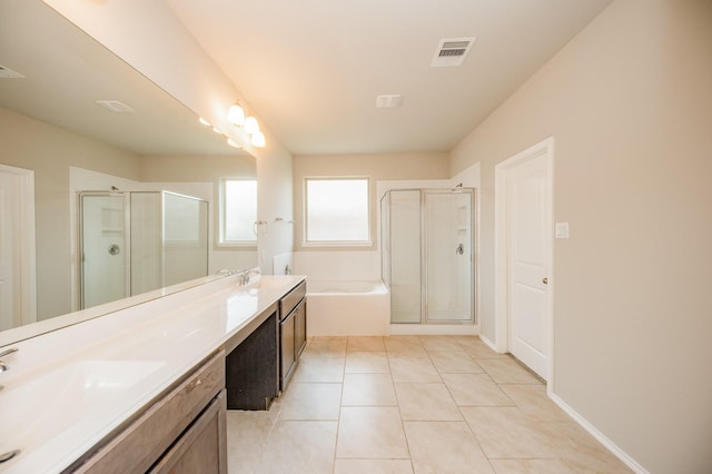 bathroom with independent shower and bath, tile patterned floors, and vanity