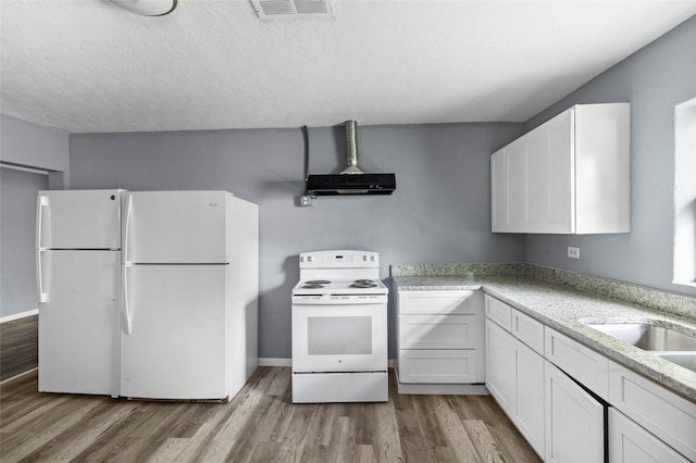 kitchen featuring white cabinetry, light stone countertops, white appliances, and light hardwood / wood-style flooring