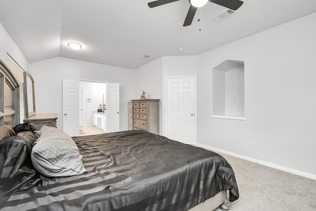 carpeted bedroom featuring ceiling fan, connected bathroom, and vaulted ceiling