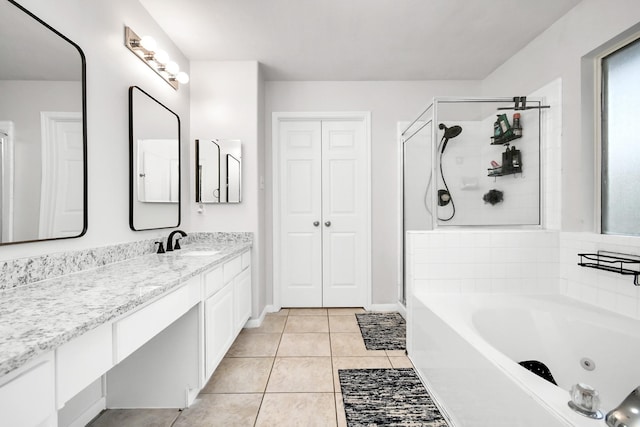 bathroom with tile patterned floors, vanity, and separate shower and tub