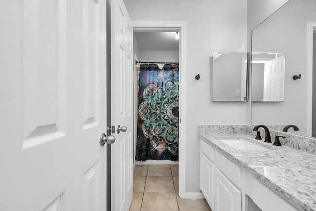 bathroom with tile patterned floors and vanity