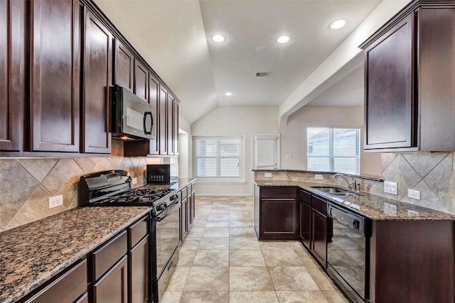 kitchen featuring sink, backsplash, dark stone countertops, black appliances, and lofted ceiling