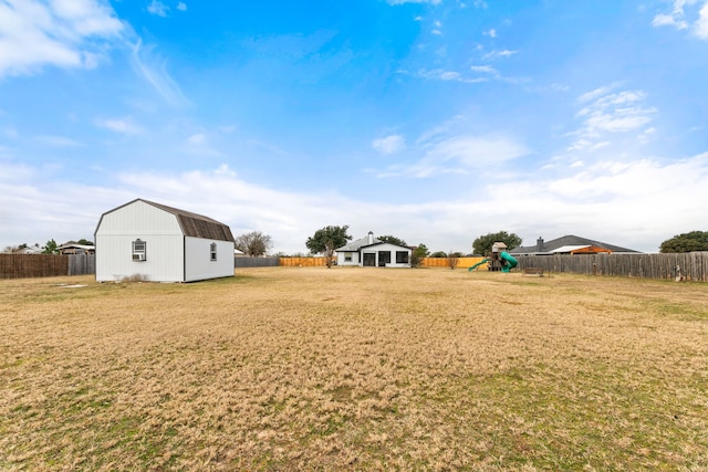 167 Hay Meadow Rd, Cedar Creek, TX 78612 - view of yard with a playground and an outdoor structure