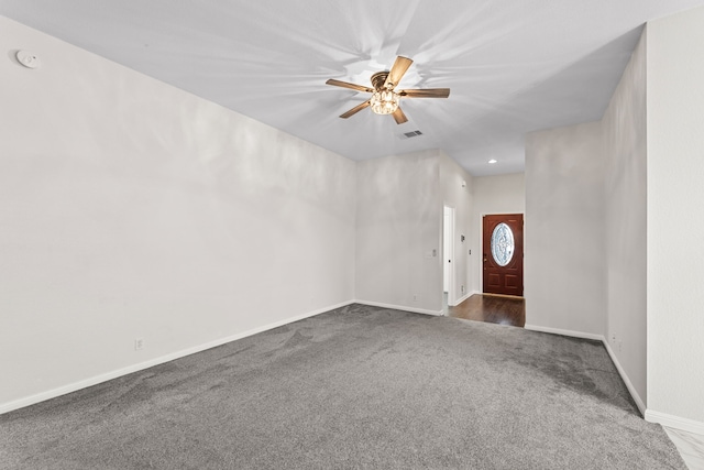 carpeted entrance foyer with ceiling fan