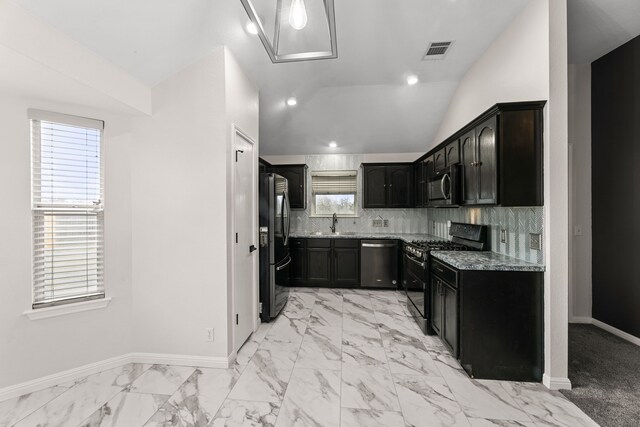 167 Hay Meadow Rd, Cedar Creek, TX 78612 - kitchen with black gas range oven, dishwasher, freestanding refrigerator, stone counters, and a sink