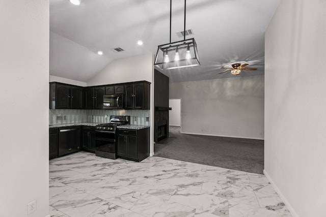 kitchen with pendant lighting, vaulted ceiling, backsplash, light stone countertops, and black appliances