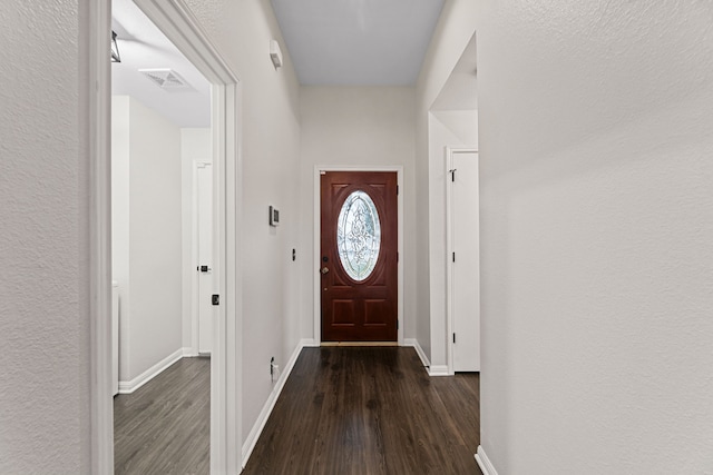 doorway to outside with dark hardwood / wood-style floors