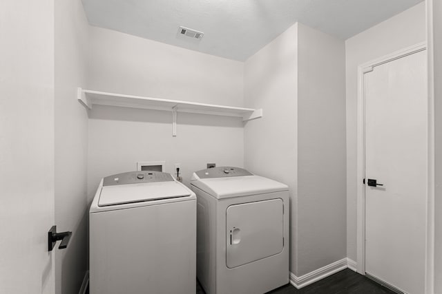 washroom with washer and dryer