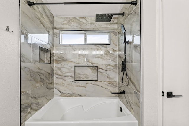 bathroom with tiled shower / bath combo