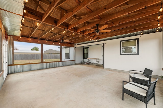 exterior space with rail lighting and ceiling fan