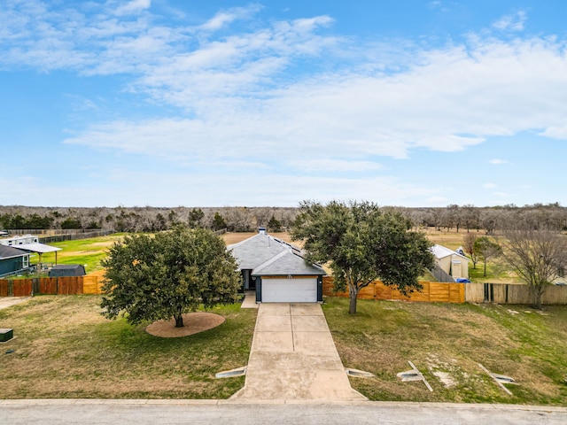 view of front facade featuring a garage and a front lawn