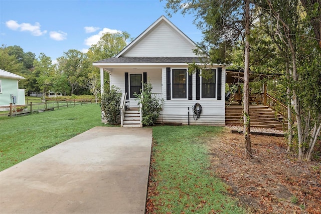 bungalow featuring a front yard and a porch