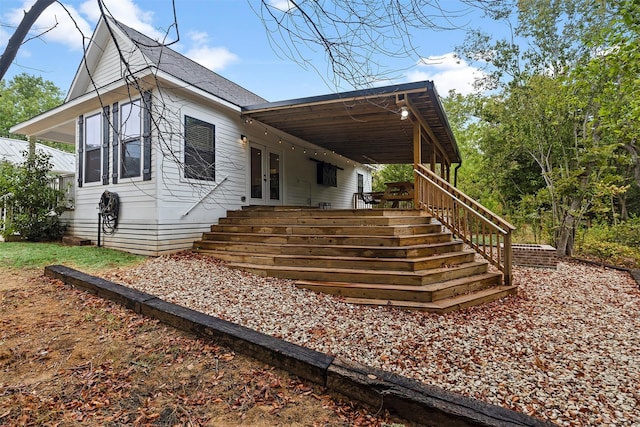 view of side of home featuring french doors